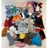 A quantity of vintage and modern dolls clothes, mostly for Sindy/Barbie style dolls. To include