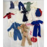 A collection of vintage Sindy dolls clothes. To include wedding dress & veil, riding jacket &