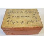 A boxed 1920's Chad Valley Mah-Jong set in original red card box. A complete set of 144 wooden tiles