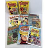 A collection of assorted comics, books and calendars to include Beano, Buster, Dandy and Whoopee!.