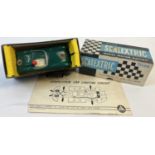 A Boxed 1960's Tri-ang Scalextric green Aston Martin MM/C57 racing car with electric head and tail