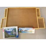 A wooden puzzle board with 4 pull out trays to underside, together with 2 boxed puzzles. Board