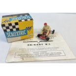 A boxed 1960's Tri-ang Scalextric Electric Model Racing K/1 Go-Kart in red. Together with original
