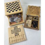 2 wooden games compendiums, one handmade. Both with pieces for chess, draughts and solitaire.