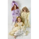 3 large soft bodied porcelain dolls. To include a bride doll and an "Emily" Alberon doll in a floral