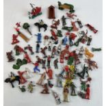A tin of assorted vintage painted lead and plastic soldiers, cowboys and figures. To include