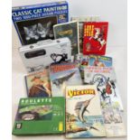 A box of assorted vintage and modern toys, books & games. To include cased WSC Real 08 Nintendo