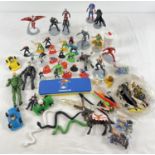 A box of assorted plastic figures and play pieces, mostly Marvel. To include Marvel Disney Store