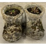 A pair of large vintage concrete garden planters modelled as boots. Each approx. 23cm tall x 44cm