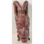 A large African hand carved heavy wood tribal mask, possibly African Mahogany. Approx. 48cm tall.