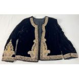 A vintage black velvet jacket with beaded and metallic thread detail. Heavily detailed bead and