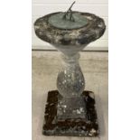 A vintage concrete 3 sectional garden sundial ornament with shaped pedestal. Approx. 75cm tall.