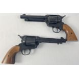 A pair of BBE ME Ranger 9mm Knall .380 replica revolvers. Both black with brown wooden grips. With