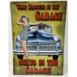 A large modern printed tin garage sign. With holes for wall fixing. Approx. 70cm x 50cm.