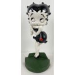 A painted cast metal flat backed door stop featuring Betty Boop. Approx. 36cm tall and weighs 2.3kg.