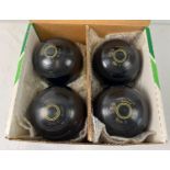 A set of 4 Thomas Taylor Lignoid lawn bowls. Size 2 mediumweight M-9450. In original box.