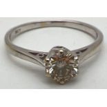 An 18ct white gold .50ct diamond solitaire ring. Ring size N. Gold marks to inside of band. Total