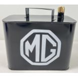A small black metal MG petrol can with brass screw top lid. Approx. 18.5cm tall.