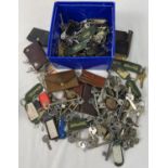 A box of 100+ keys, key pouches and keyrings. Keys in various sizes and designs.