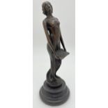 A small bronze figure of an Art Nouveau style nude, on a circular marble plinth. Approx. 19cm tall.