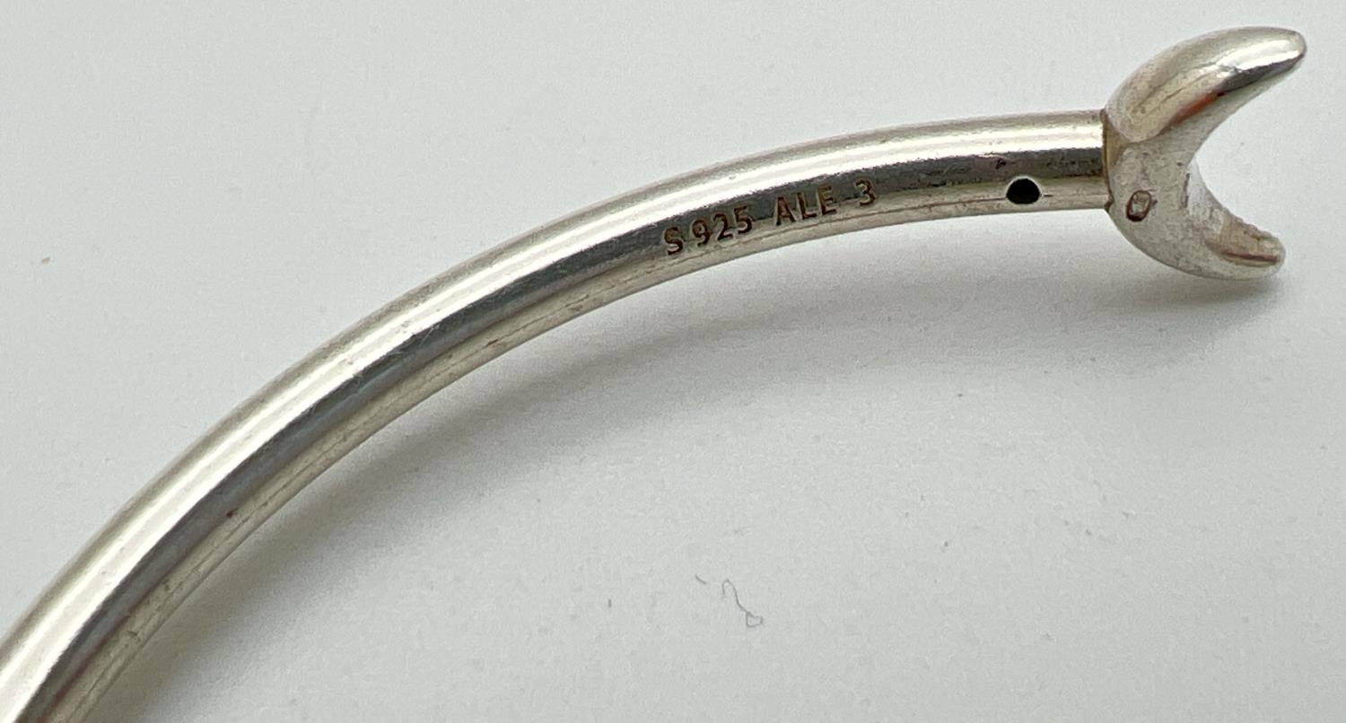 A silver star and moon stone set bangle by Pandora. Pandora silver marks to inside of bangle and - Image 3 of 3