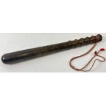 A vintage wooden truncheon with turned detail. End finial a/f. Total length approx. 38cm.