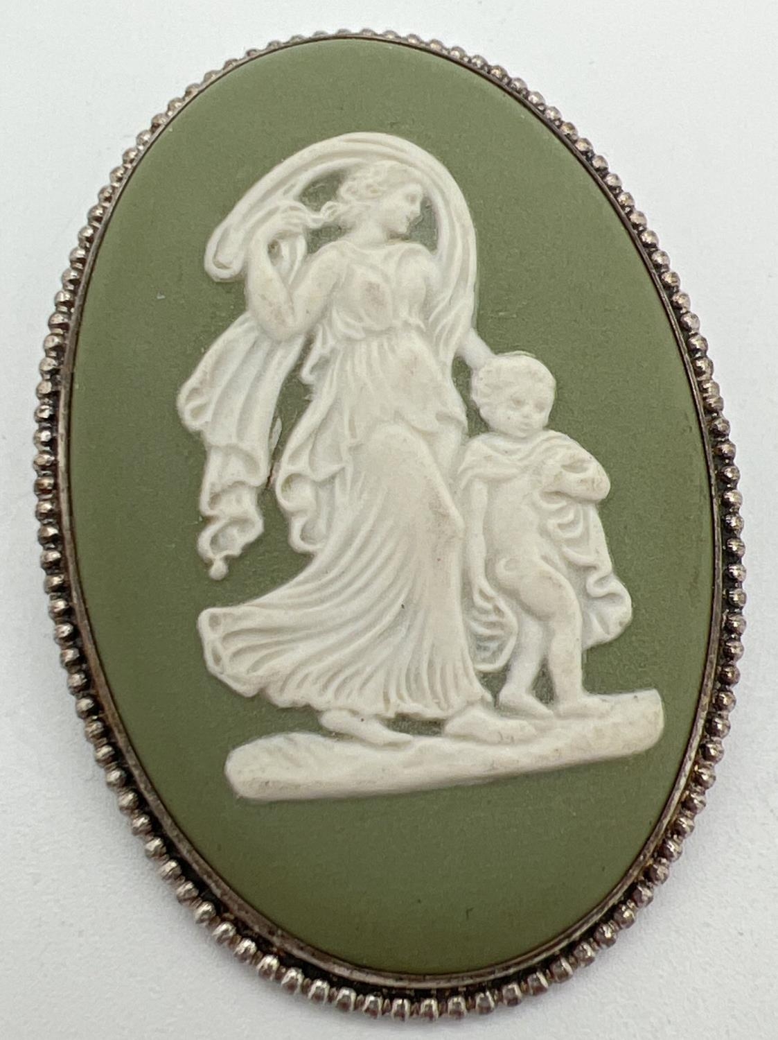 A vintage large oval shaped green Wedgwood brooch in silver rope design mount. Hallmarked London