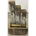 A modern stone effect resin garden electrical water feature. Not tried or tested. Approx. 74cm