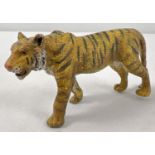 A small cold painted bronze figure of a tiger - after Bergman. Approx. 5.5cm tall x 11cm long.