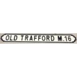 A modern painted wood Manchester United FC sign for Old Trafford. In the style of an old street