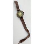A WWI silver cased military wrist watch with leather strap, subsidiary seconds dial and enamelled