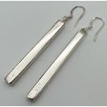 A pair of modern design solid silver rectangular drop earrings. Silver marks to body of earrings and