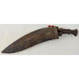 A vintage leather sheathed, curve bladed Gurkha Kukri knife, with 2 small karda knives - 1 not