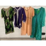 4 ethnic style tunics in varying sizes. To include black and green patterned cotton with