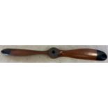 A very large wooden propellor with black painted tips. Approx. 195cm long.