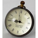 A top winding glass ball watch, bound in brass with roman numeral markers. Approx. 6cm diameter.