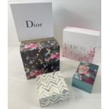 A collection of decorative boxes. To include 2 x Dior cosmetic boxes, a floral design wooden box