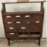 A vintage pine wall hanging set of drawers with under & over shelves. 2 bottom drawers missing.