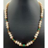 An 18" freshwater pearl & malachite necklace with gold tone spacer beads and magnetic barrel