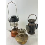 A 1943 black painted railway lamp with clear glass front and Sherwood's ceramic wick holder.