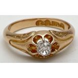 An Victorian style 15ct gold claw set single diamond dress ring. Floral detail to shoulders. Approx.