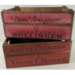A pair of reproduction wooden 2 handled crates with champagne advertising. Side panels decorated