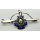 A silver Royal Marine sweetheart pin back brooch with enamelled detail and safety chain. Stamped