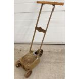 An antique cast iron line marker, marked 'S.I.F Suffolk Auto'. With replacement wooden handle, has