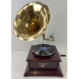 A reproduction wooden cased table top, wind up, trumpet gramophone marked "Victrola".