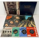 A collection of 8 vintage The Beatles vinyl records, 4 LP's & 4 7" singles, together with a The