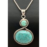 A modern design white metal twist shaped pendant, set with 2 turquoise stones on an 18" silver snake