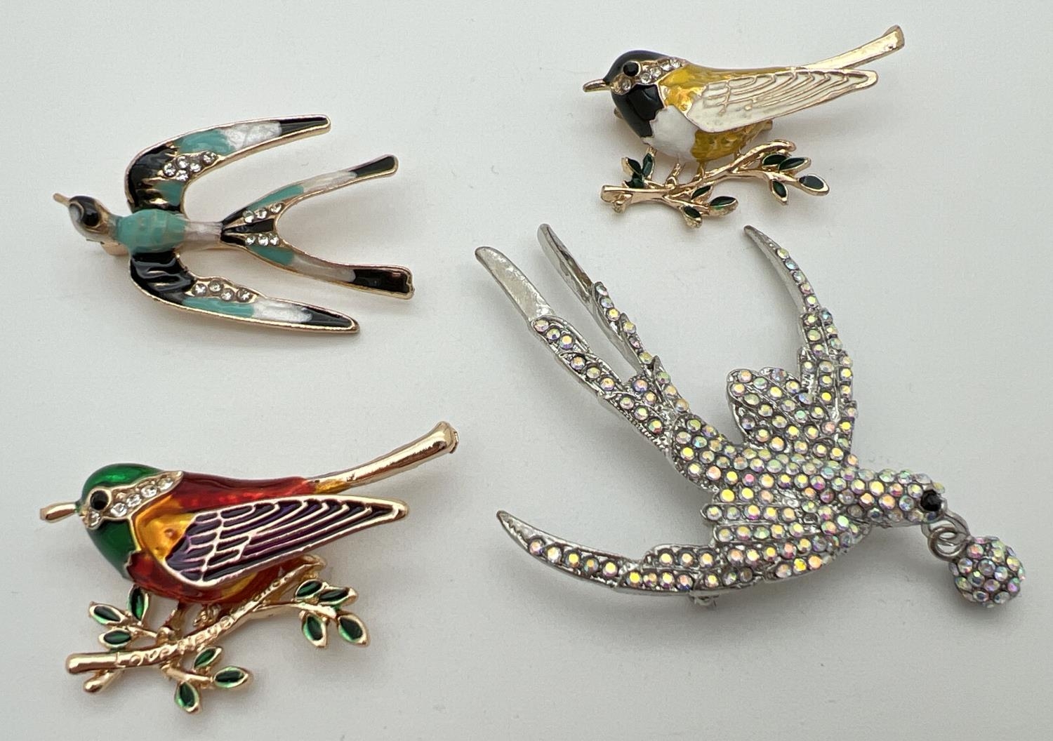 4 costume jewellery stone set and enamelled bird shaped brooches. To include heavily stone set