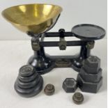 A vintage set of black painted 'The Viking' kitchen scales with brass bowl and a selection of