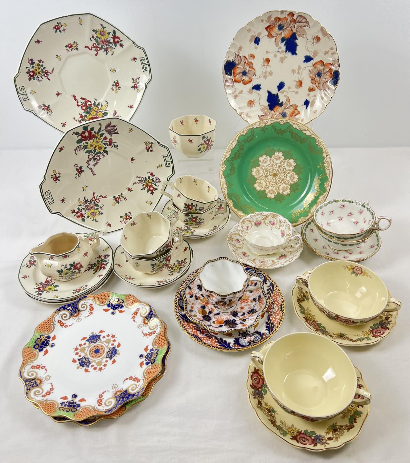 A box of assorted vintage ceramic cups & saucers & misc teaware. To include Wedgwood, Derby and